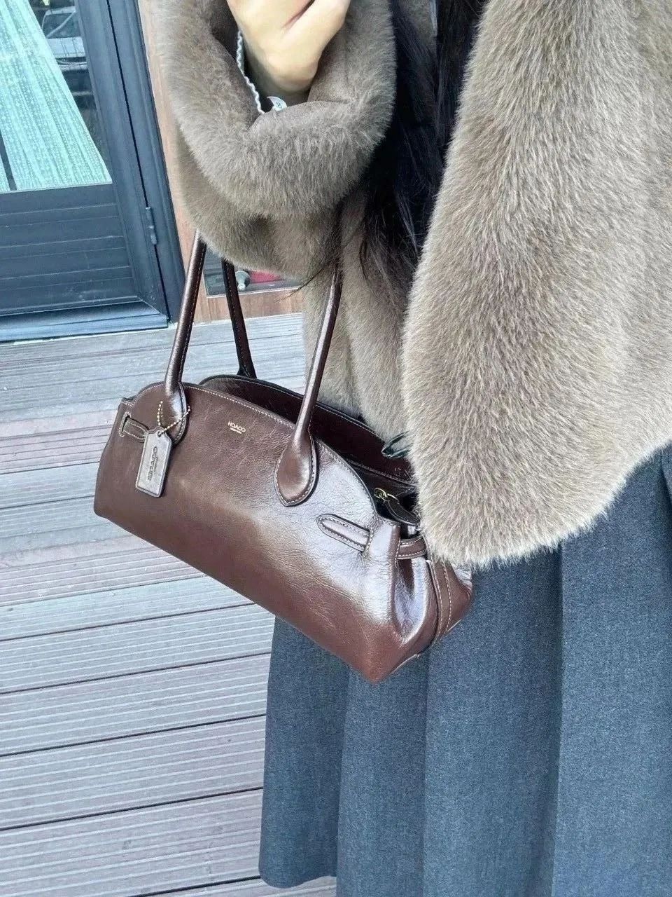 威尼斯网址中产看不上的COACH又行了？(图2)